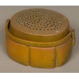 A 19th century Japanese bronze hand warmer Of ribbed rounded rectangular form,