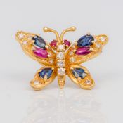 A 14K gold diamond and gem set brooch Worked as a butterfly. 2.8 cm wide.