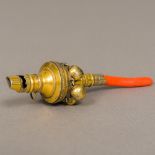 An early 19th century silver gilt coral mounted baby's rattle Incorporating a whistle. 12.