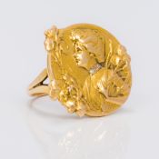 A 14 K gold Art Nouveau ring Embossed with a young lady wearing a diamond collar,