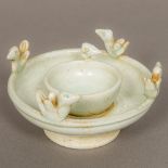 A Chinese Song Dynasty pottery oil lamp With applied birds and celadon glaze. 11.5 cm diameter.