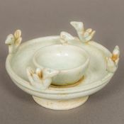 A Chinese Song Dynasty pottery oil lamp With applied birds and celadon glaze. 11.5 cm diameter.