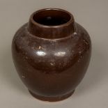 A Chinese pottery ovoid vase With allover brown glaze,
