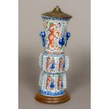 A Chinese porcelain lamp base Modelled as an archaistic twin handled vase with flanges. 43 cm high.