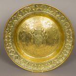 An antique, possibly 17th/18th century brass alms dish With repousse decoration,