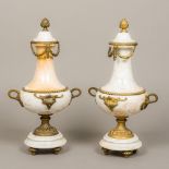 A pair of gilt metal mounted white marble garniture vases With twin handle. 48 cm high.