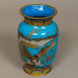 A late 19th/early 20th century cloisonne vase Decorated in the round on blue ground with a bird of