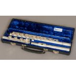 An American 20th century solid silver flute by Gemeinhardt, model 3S and numbered 624947 Cased.