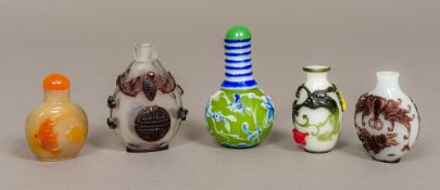 A Chinese Peking glass cameo scent bottle Decorated in the round with blue and white floral sprays