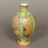 A Chinese porcelain baluster vase Well painted with birds amongst floral panels interspersed with