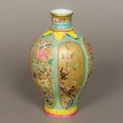 A Chinese porcelain baluster vase Well painted with birds amongst floral panels interspersed with