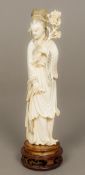 A late 19th/early 20th century Chinese carved ivory figure of Guanyin Typically worked. 26.