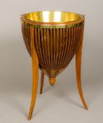 A brass mounted line inlaid mahogany coal bucket Of pierced horizontal banded form,