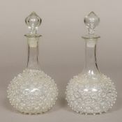 A pair of unusual 19th century blown glass decanters and stoppers Both with 'studded' decoration.