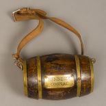 A small Hennessy Cognac barrel Of typical coopered form, mounted with leather dog strap. 17.