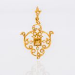 An Edwardian 15 ct gold citrine and seed pearl pendant Of pierced scrolling form,