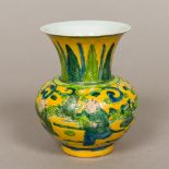 A Chinese polychrome decorated porcelain vase Worked with processional figures in the round,