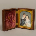 A 19th century portrait miniature on ivory Depicting a young boy and girl inscribed Julian et