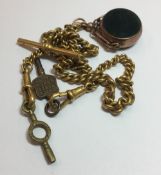 A 9 ct gold fob seal on a gold plated watch chain