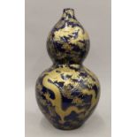 A Chinese blue ground double gourd gold splash vase