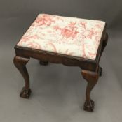 A late 19th/early 20th century cabriole legged stool