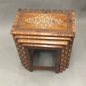 A late 19th/early 20th century Anglo-Indian nest of four ivory inlaid hardwood tables