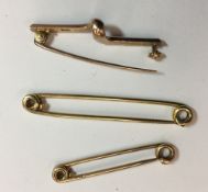 A 14 ct gold tie pin (3.2 grammes), together with two 9 ct gold tie pins (5.