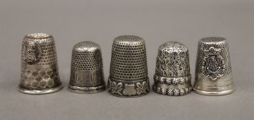 Five silver thimbles