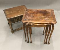 A nest of three tables and an oak side table