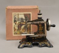 A boxed child's sewing machine