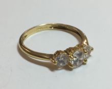 A 9 ct gold three stone ring (2.