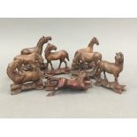 A collection of Oriental carved wooden horses
