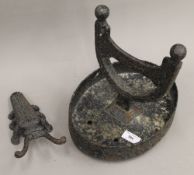 A Victorian cast iron boot scraper and an insect form boot hook