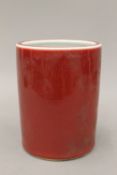 A Chinese red ground porcelain brush pot
