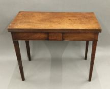 A George III mahogany fold-over tea table