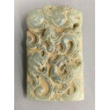 A carved jade rectangular pendant