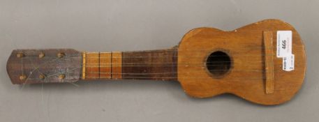 A ukulele mounted an armadillo carapace