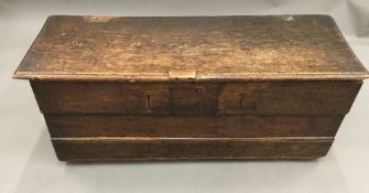 An 18th century oak and elm coffer (adapted)