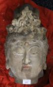 A large Chinese carved wooden Buddha head