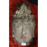 A large Chinese carved wooden Buddha head