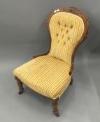 A Victorian yellow upholstered button back nursing chair
