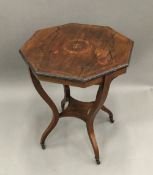 A Victorian inlaid rosewood octagonal centre table