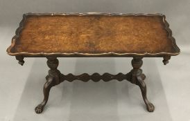 A mid-20th century burr walnut coffee table