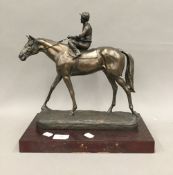 A resin model of a horse with jockey up