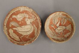 Two primitive antique bowls decorated with birds, decorated with white slip,
