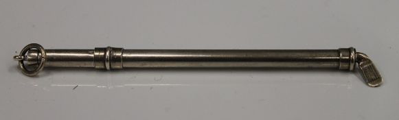 A sterling silver swizzle stick set as a golf club