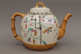 A 19th century Staffordshire teapot with faux bamboo decoration