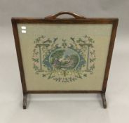 A needlework fire screen