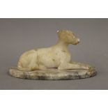 A 19th century alabaster model of greyhound. Greyhound 13 cm wide.