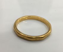 A 22 ct gold wedding band (3.3 grammes). Ring size O.